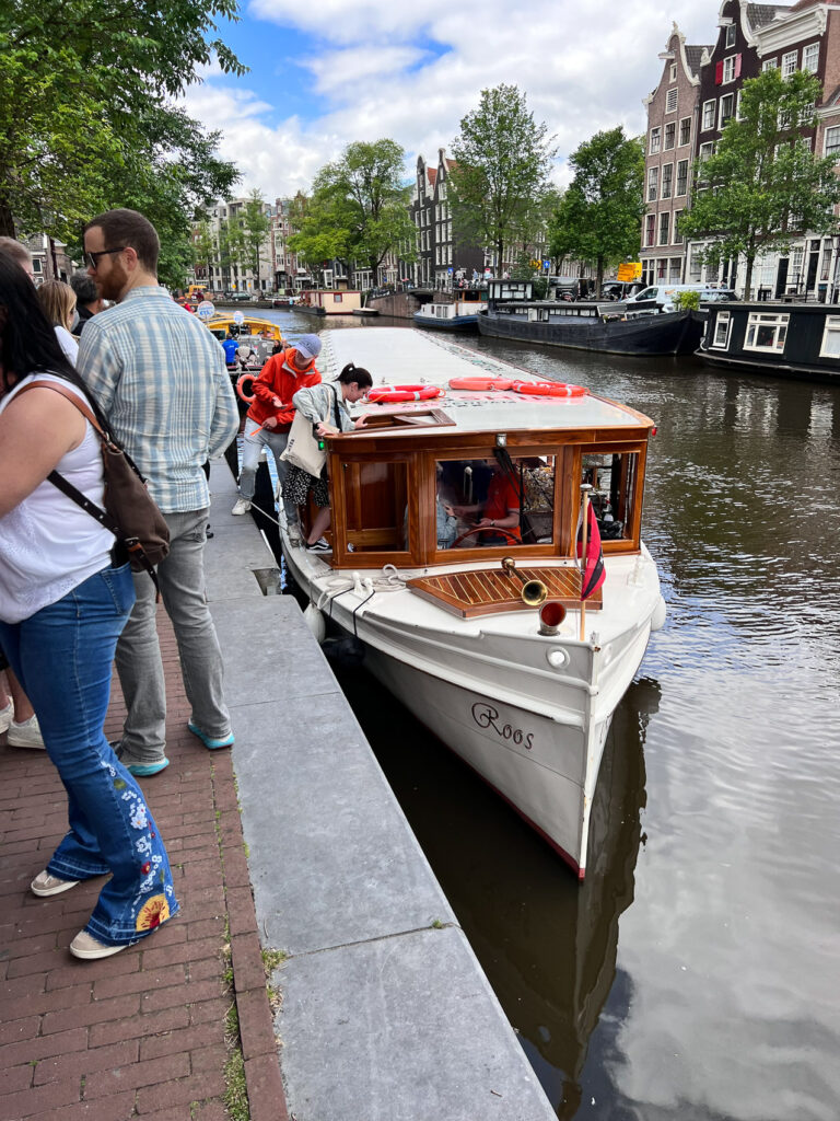 Boarding a wine and cheese canal tour in Amsterdam